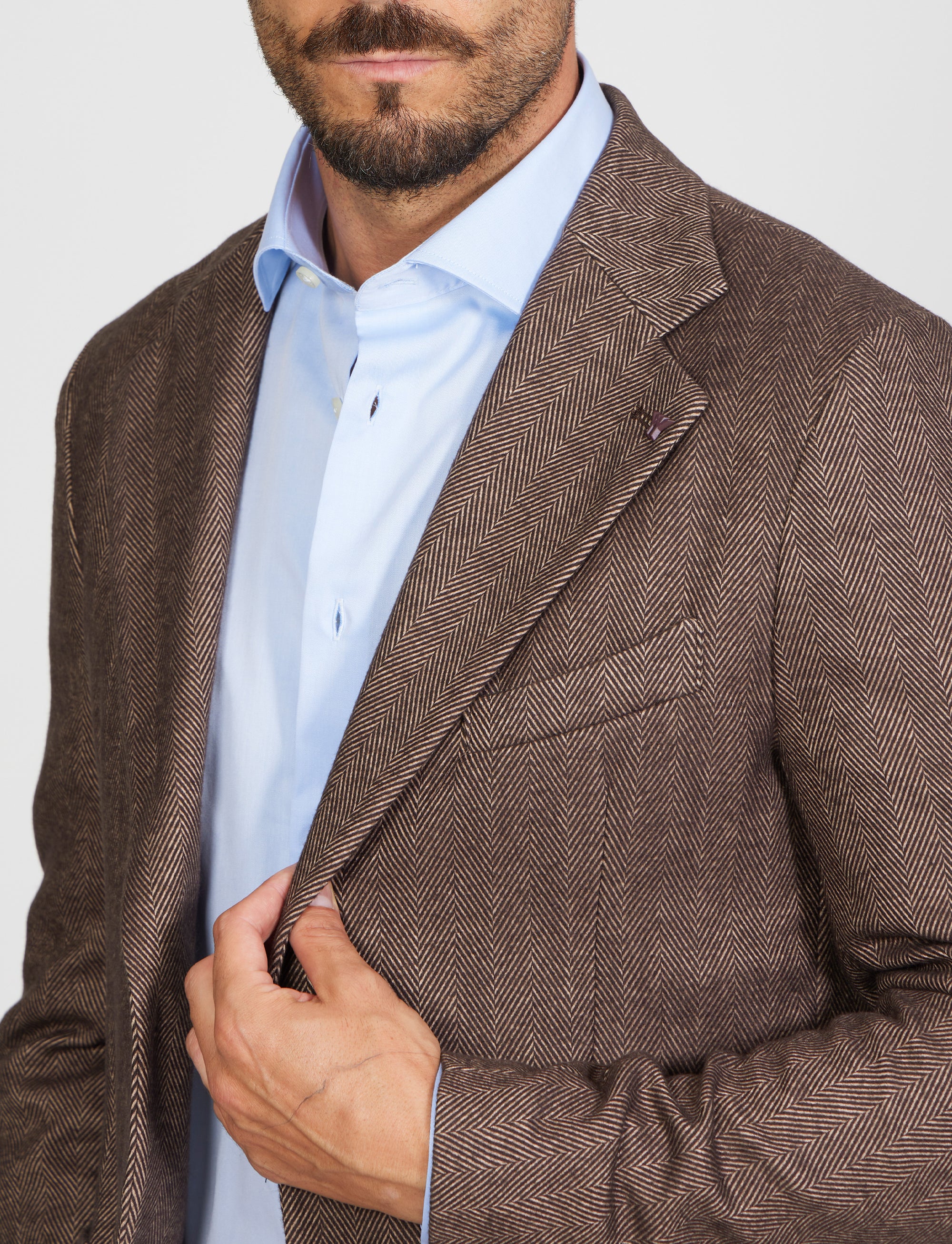 Giacca tre bottoni tessuto spigato