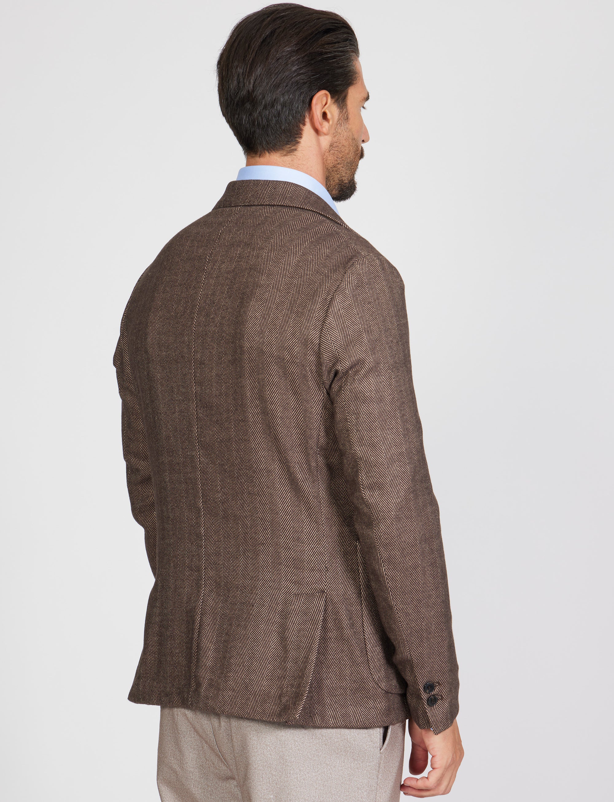 Giacca tre bottoni tessuto spigato