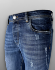 Jeans regular lavaggio medio usurato