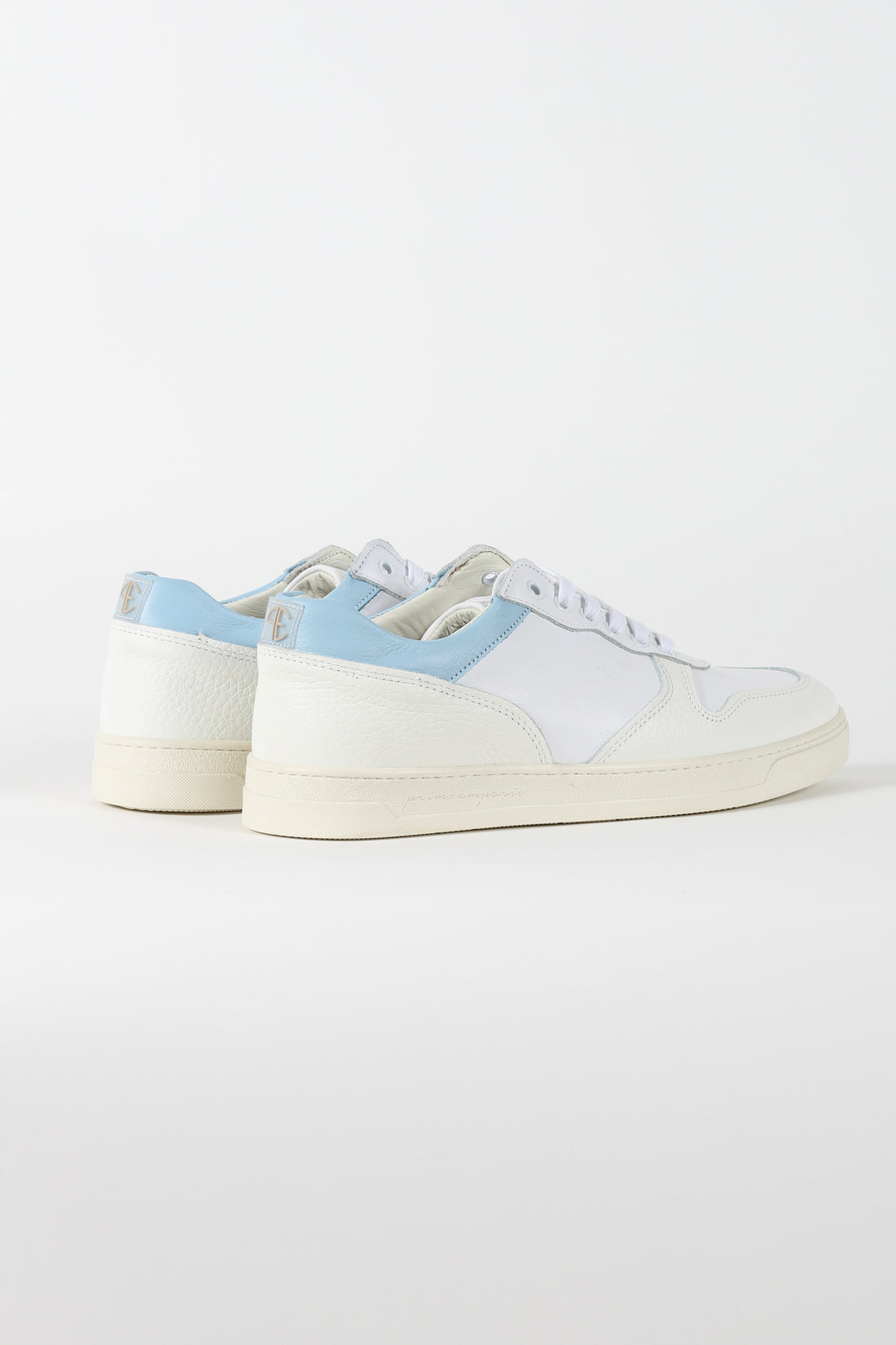 White sneakers Perforated logo on the back. Light blue