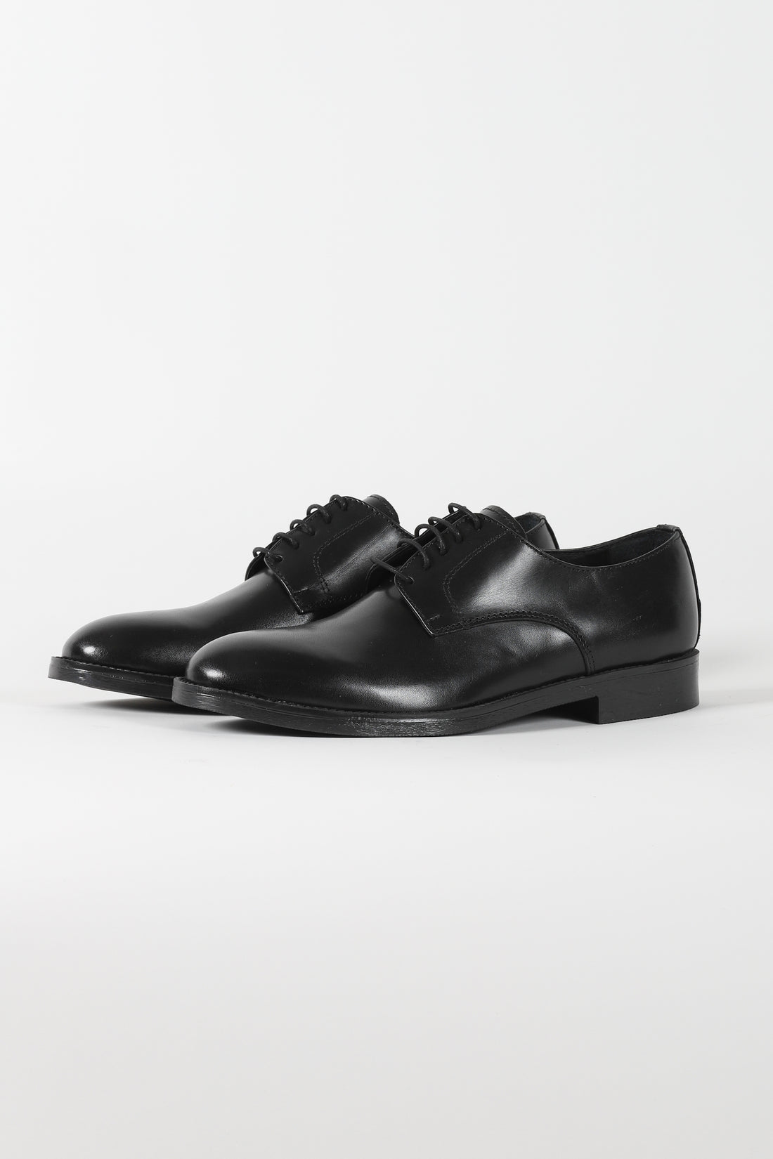 Black lace-up shoe with rubber sole